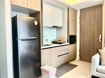 a small kitchen with a stainless steel refrigerator at Circle 31 #1BR Bangkok in Bangkok
