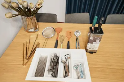 a wooden table with utensils on top of it at 906 Bangkok City Center Single Pool Villa BTS Asok 5 Bedrooms 6 Bathrooms in Bangkok