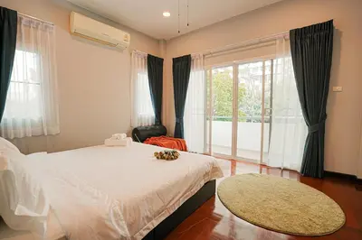 a bedroom with a white bed and a large window at 906 Bangkok City Center Single Pool Villa BTS Asok 5 Bedrooms 6 Bathrooms in Bangkok
