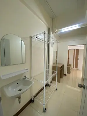 a bathroom with a sink and a mirror at Homey Place 2 in Ban Song Hong