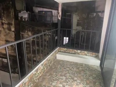 a balcony with a metal railing and a tile floor at Am Am Place C แอม แอม เพลส C Near Rajmangkala Stadiume in Sathani Khlong Tan