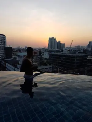a person standing on top of a rooftop at Sky Residence in Ekkamai in Bangkok