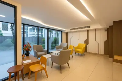 a waiting room in a hospital with chairs and tables at Zenith Place Huge 2BR Low-rise condo in Bangkok