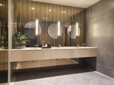 a bathroom with a sink and three mirrors at Luxury Japanese Onsen Reserve - Bangkok in Bangkok