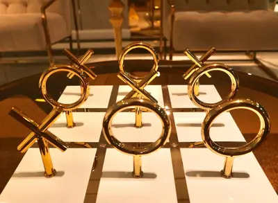 a group of gold pairs of scissors on a table at ICON NARINDRA SUITES HOTEL Sukhumvit Bangkok Thailand 50sqm to 90sqm Rooms & FREE Minibar in Bangkok