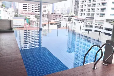 a swimming pool on top of a building at ICON NARINDRA SUITES HOTEL Sukhumvit Bangkok Thailand 50sqm to 90sqm Rooms & FREE Minibar in Bangkok