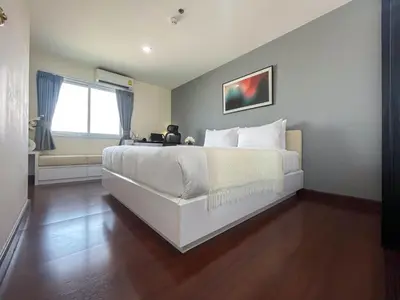 a bedroom with a white bed and a window at Modern Cityscape1BR - Ultra Fast WiFi - BTS On nut in Bangkok