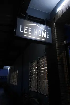 a sign that says ice home on the side of a building at Lee Home Bangkok in Bangkok