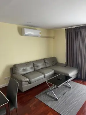 a living room with a couch and a table at 2 Bed Condo in the Heart of Bangkok in Bangkok
