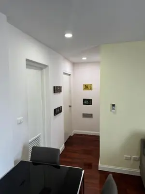 a room with a desk with a computer in a room at 2 Bed Condo in the Heart of Bangkok in Bangkok