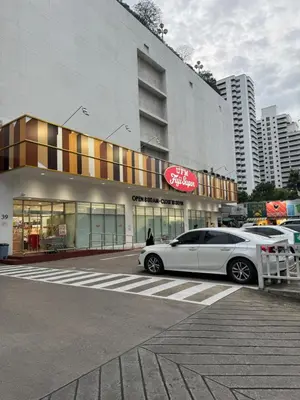 a white car parked in front of a building at 2 Bed Condo in the Heart of Bangkok in Bangkok
