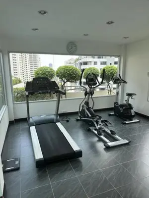 a gym with two exercise bikes in a room at 2 Bed Condo in the Heart of Bangkok in Bangkok