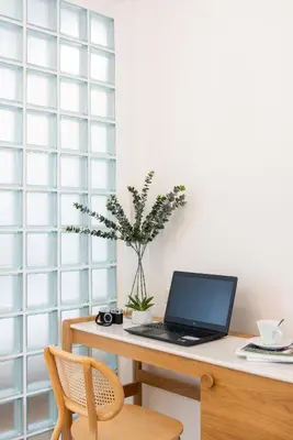 a desk with a laptop computer on top of it at 3789 Elevator Villa in Bangkok