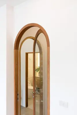 an archway in a hallway with a mirror at 3789 Elevator Villa in Bangkok