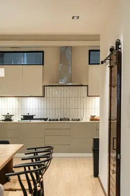 a kitchen with a table and chairs in a room at Asok house Sukhumvit27 Free BF in Bangkok
