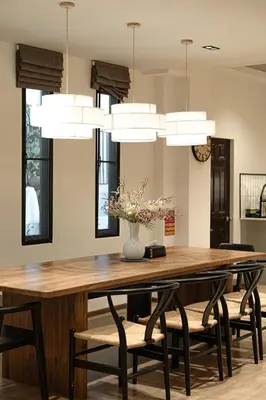 a dining room with a table with chairs and lights at Asok house Sukhumvit27 Free BF in Bangkok