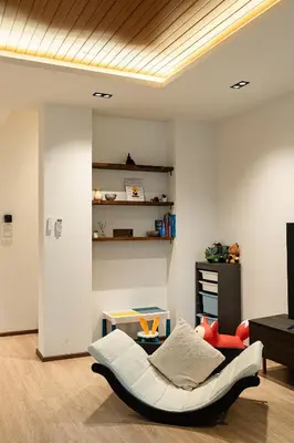 a living room with a white couch and a table at Asok house Sukhumvit27 Free BF in Bangkok