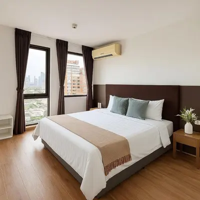 a bedroom with a large bed and a large window at Nana SkyView Retreat 2 Bedroom 2 Bath Nana BTS in Bangkok