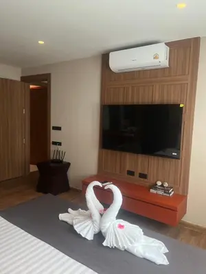 two swans making a heart in a hotel room at Stylish Apartment in Sukhumvit in Bangkok