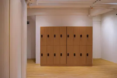 a room with a bunch of lockers in a building at BEAT Warii Hostel at Chaophraya River in Bangkok