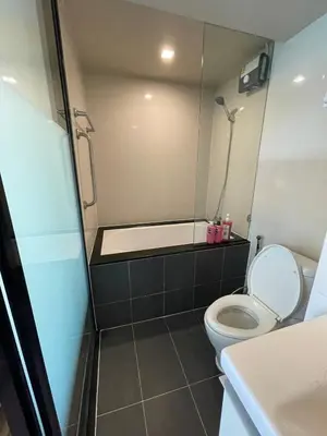 a bathroom with a toilet and a bath tub at 4Pax MRT BTS Asoke, Terminal21 in Bangkok