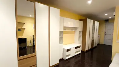 a room with white closets and a hallway at Silom room 1bedroom with 2 Kings bed for 4 persons in Bangkok