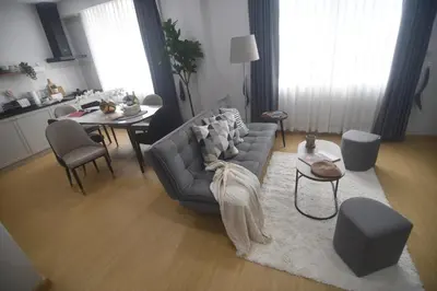a living room with a couch and a table at SiS at Sathorn St Louis in Bangkok