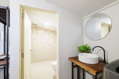 a bathroom with a sink and a mirror at Baan Apak in Godown