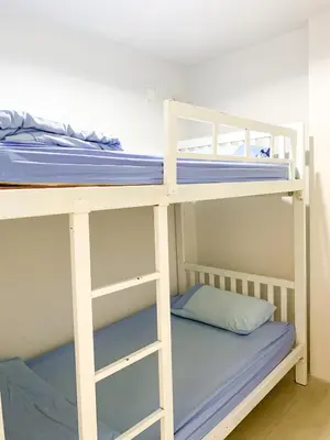 a pair of bunk beds in a room at 1sabai in Bangkok