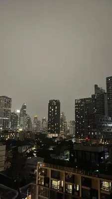 a view of a city at night with tall buildings at Beautiful condo, BTS Thonglor, 5mins by walking in Bangkok