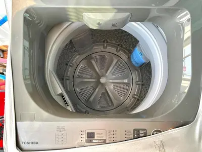 a large washing machine is in a box at Cosy Studio near BTS in Bangkok