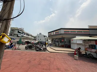 a city street with motorcycles parked in front of a building at GM6 - Samyan 4floors, 4mins walk to Bantadtong in Bangkok