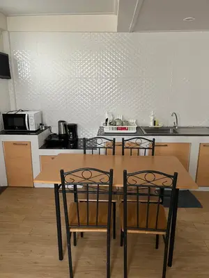a kitchen with a table and chairs in a kitchen at GM7 - Private House Downtown 2mins walk to metro in Bangkok