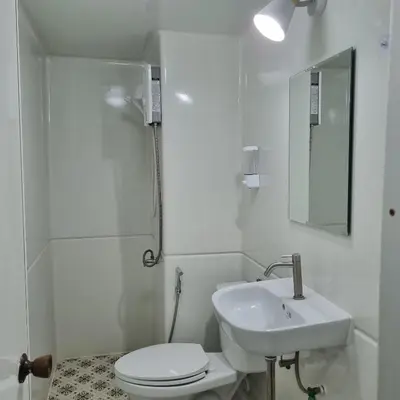 a white bathroom with a sink and a toilet at Popular Muang Thong Condo, Building T9, Floor 8, Room 20 in Ban Bang Phang