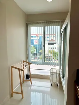 a room with a table and a large window at 2 mins to SRT I Urban Hideaway near Park in Bangkok