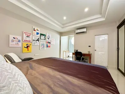 a bedroom with a bed and a desk at 2 mins to SRT I Urban Hideaway near Park in Bangkok