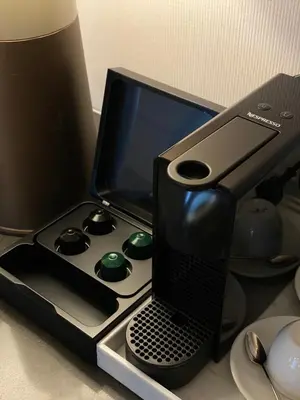 a laptop computer sitting on top of a desk at Courtyard by Marriott Bangkok Sukhumvit 20 in Bangkok