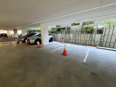 a parking garage with a car parked in it at Cozy stay! Near Chatuchak Market 814 in Bangkok