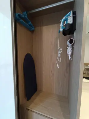 a room with a cupboard with a speaker and aperature at Amazing 1 bedroom 2 mins walk BTS On Nut in Bangkok