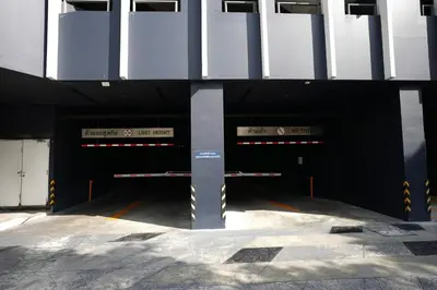 a parking garage with two entrances to a building at Life Ladprao 2 bedrooms condo in Bangkok
