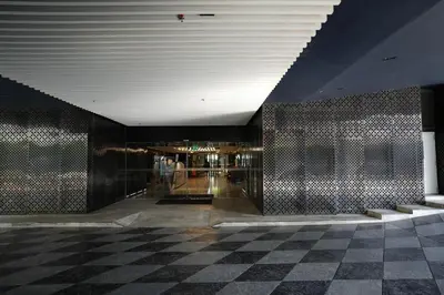a lobby with a checkered floor in a building at Life Ladprao 2 bedrooms condo in Bangkok