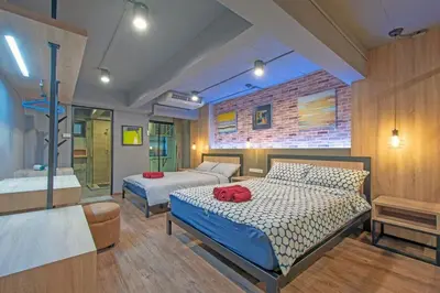 a bedroom with two beds in a room at Private apartment in Huaikwang in Bangkok
