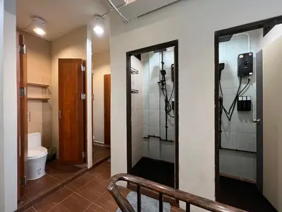 a bathroom with a shower stall and a toilet at smoking buddy house in Bangkok