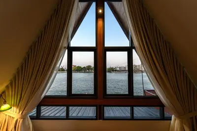 a window with a view of the water at Baan Manee BKK in Bangkok