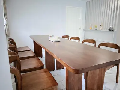 a large wooden table with chairs in a room at 5 beds private garden resort 452sqm Pet relax in Sathani Ban Hua Mak