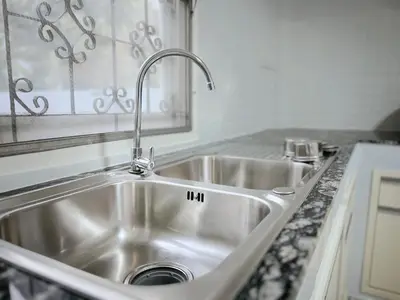 a stainless steel sink in a kitchen at 5 beds private garden resort 452sqm Pet relax in Sathani Ban Hua Mak