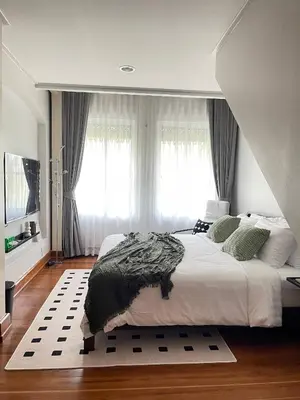 a bedroom with a large bed and a large window at Nueng Rana 113 Unique House in Chinatown 3BR 2BA - Villa in Samphanthawong