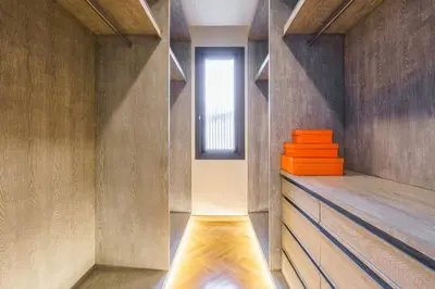 a room with a window and a shelf with orange objects at Designer 49 Pool Villa in Bangkok