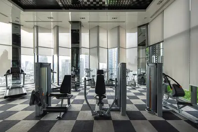 a gym with cardio equipment in a building at City Oasis: 5 Min to Metro, Pool & Gym, Essentials in Khlong Toei