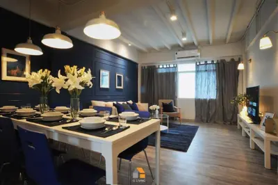a dining room and living room with a table and chairs at Baan Sri-kram 550m from MRT Taopoon in Bang Su